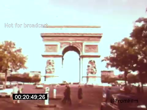 The still likely features the Arc de Triomphe, a renowned monument in Paris, framed by trees and bustling street activity. The film, 'Vincent Van Gogh: A Self-Portrait' (1961), featuring Lee J. Cobb, explores the life and work of the iconic painter, possibly using this backdrop to illustrate Van Gogh's connection to France. The vibrant colors and composition may reflect Van Gogh's artistic style, enhancing the thematic essence of the film.