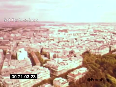 The still from *Vincent Van Gogh: A Self-Portrait* (1961) features an aerial view of a cityscape, showcasing buildings and greenery. The vintage 16mm film quality gives it a soft, warm hue, evoking a nostalgic feeling. Lee J. Cobb's voice likely adds depth to the portrayal of Van Gogh's life and artistic journey, creating an immersive experience.