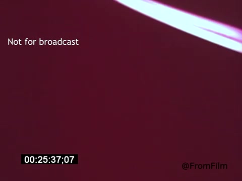 The still from 'Vincent Van Gogh: A Self-Portrait' (1961) features a rich, abstract background with shades of red and pink. The focus appears to be on vibrant color rather than specific imagery, possibly emphasizing the emotional depth associated with Van Gogh's work. Text indicating 'Not for broadcast' and a timecode are present, providing context regarding the film's usage.