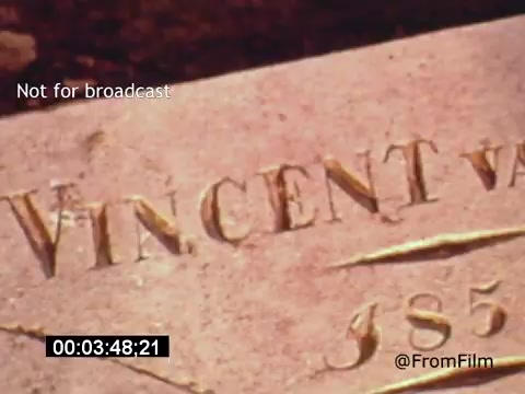 The still from 'Vincent Van Gogh: A Self-Portrait' (1961) features a close-up of a stone or plaque, likely marking Van Gogh's grave. The inscription reads 'VINCENT VAN' followed by '1853,' indicating his name and birth year. The background is blurred, drawing attention to the text, which emphasizes themes of legacy and remembrance. The film, narrated by Lee J. Cobb, explores Van Gogh's life and work, providing insight into his artistic genius.