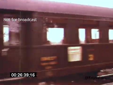 The still from 'Vincent Van Gogh: A Self-Portrait' (1961) features a moving train, captured in 16mm film, highlighting the era's cinematic style. The train is shown passing by with a slight blur, evoking a sense of motion and travel. The image is not intended for broadcast and includes a timestamp indicating its position within the film. The context suggests a journey, possibly reflecting Van Gogh's exploration of life and art.