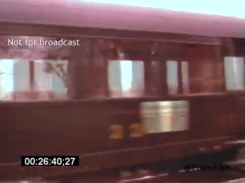 The 16mm still from 'Vincent Van Gogh: A Self-Portrait' (1961) depicts a moving train, possibly signifying movement through time or reflection on Van Gogh's life. The color palette seems muted and nostalgic, enhancing the introspective quality associated with his artistry. Lee J. Cobb’s narration likely adds depth to the visual storytelling. The image captures a fleeting moment, conveying themes of travel and exploration.