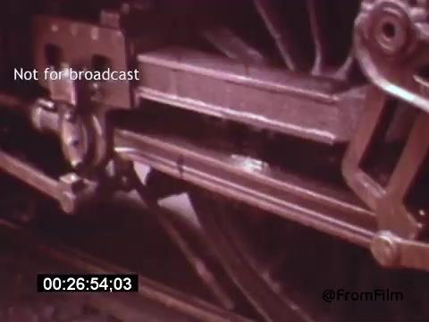 The still from 'Vincent Van Gogh: A Self-Portrait' (1961) shows a close-up view of a train's mechanical components, emphasizing the intricate motion and machinery involved. This detail adds a rhythmic element, possibly symbolizing Van Gogh's connection to the energy and movement of life. Lee J. Cobb's narration likely complements this visual with insightful commentary, enhancing the film's exploration of the artist's legacy.