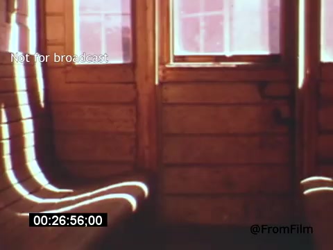 The still from *Vincent Van Gogh: A Self-Portrait (1961)* features an interior scene with wooden walls and windows. Soft light streams in, creating a serene atmosphere. The composition highlights the texture of the wood and the play of light, evoking a contemplative mood that aligns with the themes of the film. Lee J. Cobb's involvement adds depth to the narrative, exploring Van Gogh's artistic vision and emotional struggles.