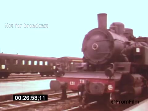 The still from 'Vincent Van Gogh: A Self-Portrait' (1961) showcases a vintage steam locomotive at a train station, with passenger cars in the background. The image evokes the historical context of the early 20th century, possibly reflecting themes of travel and transition that relate to Van Gogh's life and artistic journey. The overall composition has a nostalgic quality, enhanced by the color palette typical of the film's era.