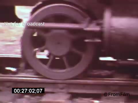This 16mm still from 'Vincent Van Gogh: A Self-Portrait' (1961) features a close-up shot of a train wheel in motion, capturing the intricate details of the machinery as it moves along the tracks. The sequence likely reflects the passage of time and the connection to Van Gogh's life and work, symbolizing movement and transformation.