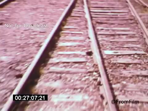 The still from 'Vincent Van Gogh: A Self-Portrait' (1961) features an evocative view of railway tracks, highlighting the gritty texture of the railway ties and stones. The perspective suggests movement, possibly signifying a journey or introspection, which aligns with Van Gogh's turbulent life. The film, narrated by Lee J. Cobb, explores the artist's emotional struggles and creative genius, making this simple yet powerful imagery a fitting visual representation of themes of journey and solitude.