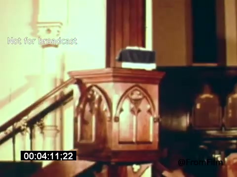 The still from 'Vincent Van Gogh: A Self-Portrait' (1961) features a wooden pulpit, likely set in a church interior. The pulpit has ornate detailing and is accompanied by a staircase leading up to it. The scene suggests an atmosphere of reflection or discourse, possibly in relation to Van Gogh's life and art. The image is framed with a time code at the bottom, indicating its origin from a film recording.