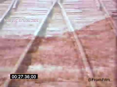 The still from 'Vincent Van Gogh: A Self-Portrait' (1961) likely depicts a close-up of train tracks, creating a sense of movement and transition. The use of color, possibly muted tones, suggests a reflection on Van Gogh's emotional state. This visual juxtaposition aligns with themes of isolation and journey, resonating with Van Gogh's life and artistry. Lee J. Cobb's narration may further enhance the emotional depth of the piece.