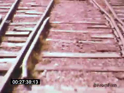 The still from 'Vincent Van Gogh: A Self-Portrait' (1961) captures a close-up of rustic railway tracks, emphasizing the textures of the weathered wood and metal. The soft colors suggest a vintage quality, possibly reflecting the emotional depth of Van Gogh's art. This scene might symbolize the journey and struggles of the artist, connecting to themes in the film. The presence of Lee J. Cobb indicates a dramatic interpretation, enhancing the narrative of Van Gogh’s life.