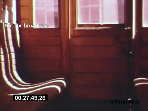 The 16mm still from 'Vincent Van Gogh: A Self-Portrait' (1961) features an intimate view of a wooden interior, likely a room reflecting Van Gogh's time. The natural light filters through windows, casting soft shadows and highlights on the wooden surfaces. This scene captures a sense of solitude and introspection, resonating with the themes of Van Gogh's life and artistry. The presence of muted colors and textures creates a contemplative atmosphere, invoking the emotional depth associated with his work.