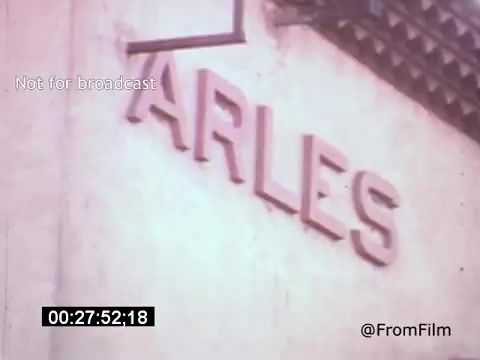 The still from *Vincent Van Gogh: A Self-Portrait (1961)* features a close-up of the word 'ARLES,' referencing the city where Van Gogh lived and painted significant works. This scene likely emphasizes his connection to the location, enhancing the narrative about the artist's life and experiences. The film, narrated by Lee J. Cobb, explores Van Gogh's artistic journey and personal struggles.