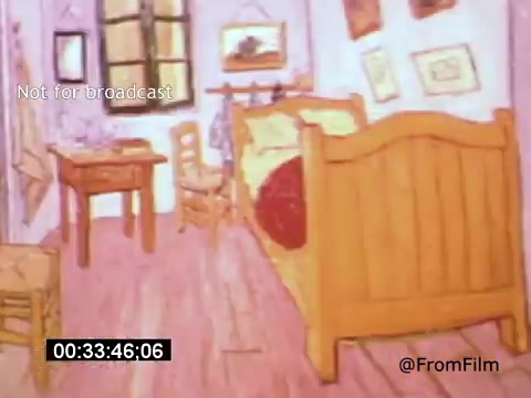 The still from *Vincent Van Gogh: A Self-Portrait (1961)* features a warm, inviting interior of a room, characterized by wooden furnishings, including a simple bed with a red coverlet, a table, and a chair. The walls are adorned with framed art, reflecting Van Gogh's vibrant color palette. A window allows light to filter in, enhancing the overall warmth of the scene. This imagery conveys the essence of Van Gogh's life and artistic environment.