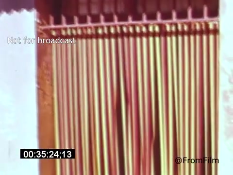 The still from 'Vincent Van Gogh: A Self-Portrait' (1961) features a close-up of a curtain made of colorful, vertical slats, likely representing the vibrant hues often found in Van Gogh's works. The scene evokes a sense of intimacy and texture, reflecting the warmth and emotional depth associated with Van Gogh's artistry. This visual context highlights the film's exploration of Van Gogh's inner world and creative spirit, narrated by Lee J. Cobb.