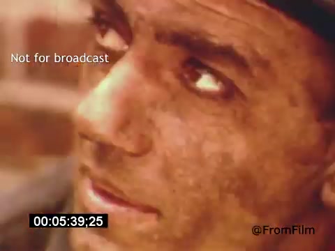 The still from 'Vincent Van Gogh: A Self-Portrait' (1961) features a close-up of an actor portraying Van Gogh, emphasizing a contemplative and intense expression. The lighting highlights the character's weathered features, which reflect the emotional depth of the artist's life. The background seems blurred, putting focus on the face, conveying a sense of introspection and struggle. The image captures the essence of Van Gogh's tumultuous spirit, complemented by the film's artistic cinematography.