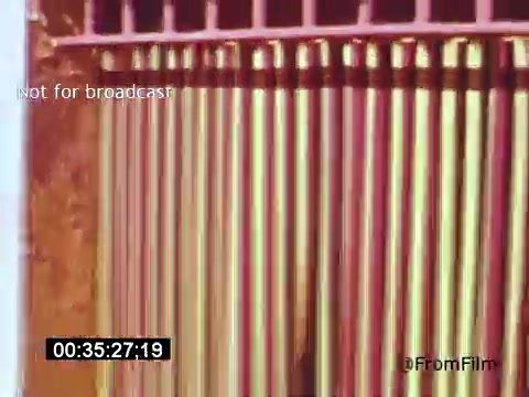 The 16mm still from 'Vincent Van Gogh: A Self-Portrait (1961)' likely features a close-up view of painted or stylized vertical lines, possibly representing Van Gogh's artistic brushwork or his symbolic approach. The colors may evoke the emotional intensity typical of his palette, contributing to the film's exploration of the artist's life and creativity. Lee J. Cobb's narration would provide depth, likely reflecting on Van Gogh's tumultuous journey and significant impact on art.