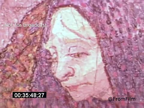 The still from 'Vincent Van Gogh: A Self-Portrait' (1961) features a close-up of a painted face, characterized by Van Gogh's distinct brushstroke style. The colors are rich and expressive, with a predominantly warm palette. This moment likely captures the emotional depth often found in Van Gogh's work. Lee J. Cobb's narration may enhance the reflection on the artist's life and struggles.