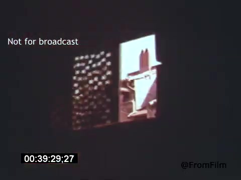 The still from 'Vincent Van Gogh: A Self-Portrait' (1961) features a window scene showcasing an outdoor view. The colors are vivid, reflecting Van Gogh's style, with a play of light and shadow. It captures a momentary glimpse, emphasizing the artistic essence and emotional depth associated with Van Gogh’s life and work, narrated by Lee J. Cobb. The image is marked as 'Not for broadcast,' indicating its use is restricted.