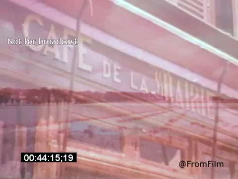 The still from 'Vincent Van Gogh: A Self-Portrait (1961)' features a blurred depiction of a café sign, 'Café de la Slavaire,' suggesting a connection to Van Gogh's life in France. The imagery evokes a sense of nostalgia and atmosphere associated with the artist's environment. The timestamp indicates a specific moment in the film, likely enhancing the narrative about Van Gogh's experiences and influences with a visual focus on locale.
