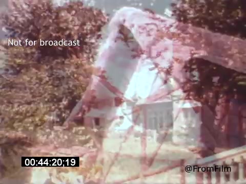 The still from 'Vincent Van Gogh: A Self-Portrait' (1961) appears to present a dreamlike image with layers of color and soft focus. It captures a scene that likely evokes the essence of Van Gogh’s world, integrating natural elements and architectural features. The muted colors suggest an impressionistic style, aligning with Van Gogh's artistic influences. The text overlay indicates the image is not for broadcast, and a timecode is visible, marking the point in the film.