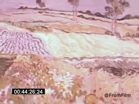 The 16mm still from 'Vincent Van Gogh: A Self-Portrait' (1961) features a vibrant depiction of a landscape, characterized by rolling fields and trees. The soft, stylized brushwork and pastel colors reflect Van Gogh's emotional depth and unique artistic style. This moment captures the essence of his connection to the natural world, emphasizing the interplay of light and color. The film stars Lee J. Cobb, adding a layer of narrative exploration to Van Gogh's life and artistry.