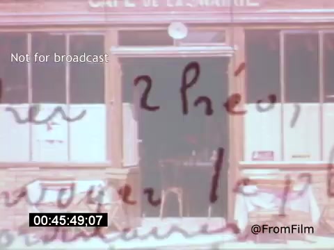 The still from 'Vincent Van Gogh: A Self-Portrait' features a close-up of handwritten text overlaying an image of a café, likely referencing Van Gogh's experiences or thoughts. The café's name, 'Café de la Marine,' suggests a connection to his life and surroundings. The scene evokes a sense of introspection, reflecting Van Gogh's artistry and personal struggles, while Lee J. Cobb's narration provides depth and context to Van Gogh's legacy.