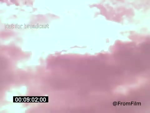 The still from 'Vincent Van Gogh: A Self-Portrait (1961)' features a dreamy, impressionistic sky filled with swirling clouds, tinted in soft shades of pink and white. The ethereal atmosphere likely reflects the emotional depth of Van Gogh's artwork and persona, while Lee J. Cobb's narration adds further gravitas to the visual experience. The scene emphasizes the connection between Van Gogh's turbulent life and his vibrant artistry.