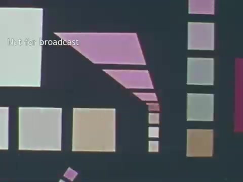 The 16mm still from the 1970s US Dairy Council PSA features abstract geometric shapes in various colors, including pink, cream, and white. The design has a retro aesthetic, with elements arranged in a somewhat dynamic, visually engaging layout. The text 'Not for broadcast' indicates that this still is a part of a promotional material intended for specific audiences rather than general public airing. Overall, the visual style reflects the era's design trends, aiming to catch viewer attention while promoting dairy products.