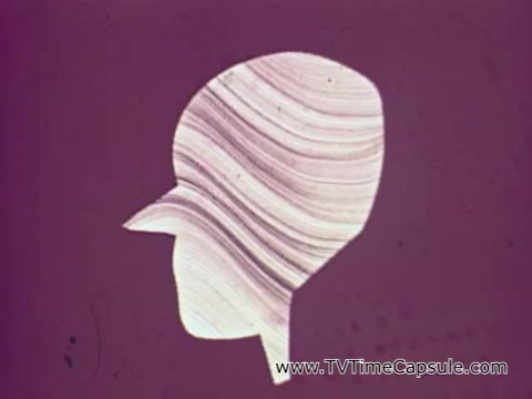 The still from the 'American Dental Association PSA - Oral Cancer' features a minimalist illustration of a human head in profile, with smooth, wavy lines that suggest an abstract representation of the skull or mouth. The background is a solid color, possibly in muted tones, which contrasts with the lighter lines of the artwork. This visual aims to convey a serious message about the dangers of oral cancer, emphasizing the need for awareness and early detection.