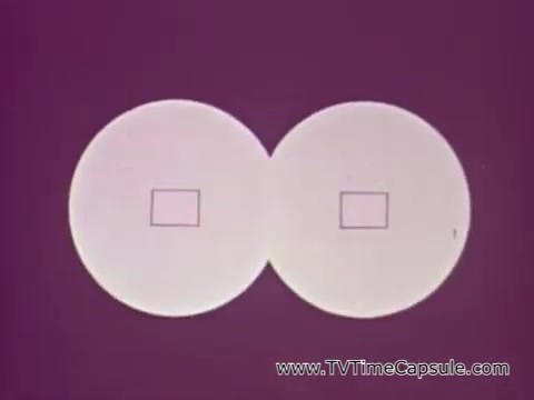 The still depicts two overlapping circles with small rectangles inside each circle, set against a plain background. The visual likely serves as a metaphor or diagram to elucidate a key point about oral cancer awareness. This PSA emphasizes the importance of early detection, highlighting the alarming statistics about oral cancer's prevalence and survival rates. The simplicity of the imagery reinforces the serious message about the necessity of regular dental check-ups and screenings.