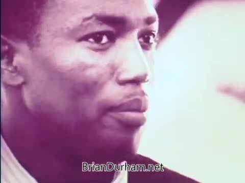 The still from the 1968 PSA 'Things Are Changing' features a close-up of a man with a serious expression. He appears thoughtful, suggesting a focus on important social themes. The context likely pertains to societal changes and progress during a transformative period in American history. The muted color palette enhances the reflective tone of the image.