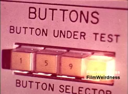 The still shows a close-up of a testing device labeled 'BUTTONS,' specifically focusing on a button selector panel. The illuminated button under test displays the number '5,' suggesting it is undergoing some verification process. The overall aesthetic has a vintage quality, reflecting the era of the 1970s Bell System, and evokes a sense of nostalgia associated with telephone technology.