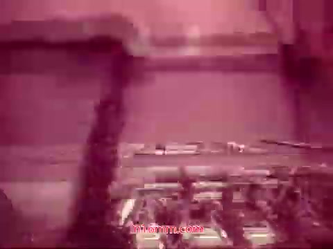 The still from 'Performance,' a Bell System Film from 1971, features a close-up view of film equipment or projectors, likely capturing the essence of the technical aspects of filmmaking. The color tones suggest a vintage aesthetic, possibly tinted or altered due to the age of the 16mm print. The end titles are visible, prominently displaying the production date and the cast and crew, marking the film's conclusion. This moment encapsulates both a sense of nostalgia and a celebration of the collaborative effort behind the film.