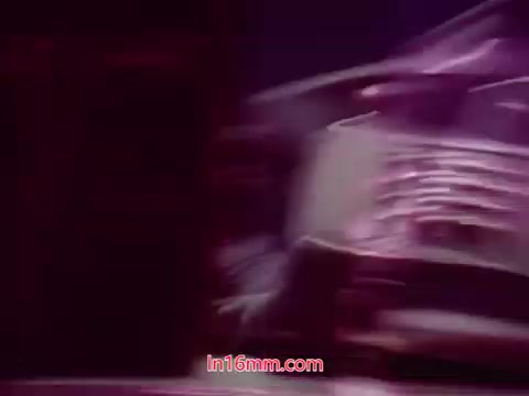 The still from 'Performance' (1971) captures the end titles of the film, presented in a stylized manner. The background features rich, purple tones, likely enhancing the cinematic aesthetic typical of the era. Text appears on the screen, listing the production date along with the names of the cast and crew involved. The overall composition suggests a blend of drama and artistry, characteristic of the film's themes.