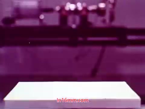 The 16mm still from 'Performance' features the end titles, displaying the production date and the credited cast and crew. The image likely showcases a stylized background, enhancing the film’s aesthetic. The color palette may include distinctive hues typical of 1971-era cinema, contributing to its overall feel. This moment marks the conclusion of the film, providing viewers with essential information about its creation.