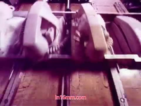 The 16mm still from 'Performance' shows a close-up of vintage telephones on a wooden surface, emphasizing their intricate details. The film's end titles indicate the production date and list the cast and crew involved. The overall visual theme reflects a nostalgic, retro aesthetic characteristic of early '70s films, possibly integrating motifs of communication and technology. This moment serves as a fitting conclusion to the film's narrative.