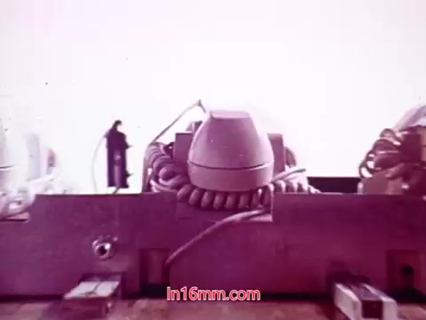 The still from 'Performance' features a surreal composition with a figure in silhouette standing amidst large, rounded objects that resemble old audio equipment or machinery. The background is a washed-out, pale color, creating a dreamlike atmosphere. Visible cables and connections suggest a technological setting, while the overall tone conveys an abstract interpretation of the film’s themes. The end titles likely provide credits and the date of production, emphasizing the film's context within the early 1970s.