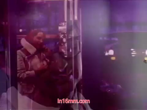 The still from 'Performance' features vibrant colors and layered imagery, typical of 16mm prints. It likely captures a moment reflecting themes central to the film, perhaps involving urban settings or interpersonal connections. The end titles prominently display the production date and credit the cast and crew, encapsulating the film's artistic essence. The visual complexity hints at the diverse storytelling techniques employed throughout the film.