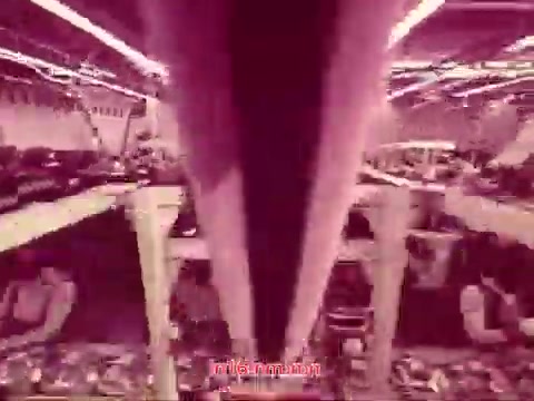 The still from the 16mm film 'Performance' - Bell System Film (1971) showcases the end titles, featuring the production date along with the cast and crew credits. The visual style highlights a unique palette and perhaps a distinct setting, reflecting the film's thematic elements. The composition suggests a blend of industrial and artistic visuals, characteristic of the era's experimental filmmaking.