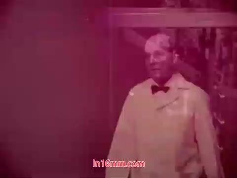 The still from the 16mm film 'Performance' features a man in a white lab coat, likely in a clinical or experimental setting. The color palette leans towards a reddish tint, giving the image a somewhat surreal or vintage feel. This segment appears to be part of the end titles, indicating the production date and credits for the cast and crew involved in the film. The overall aesthetic reflects the unique style of films from the early 1970s, emphasizing both the visual and narrative components of the production.