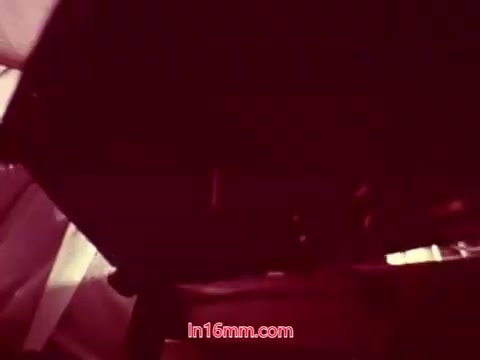 The 16mm still from 'Performance' features the end titles of the film. It likely presents the date of production, along with the cast and crew credits. The film’s visual quality may exhibit a warm, vintage hue characteristic of 16mm prints, with text typically presented in a clear, readable format against a backdrop that could be either neutral or visually textured. Overall, this still marks the conclusion of the film, summing up its production details.