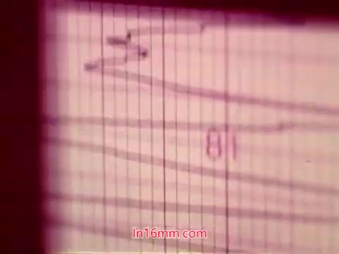 The still from the 16mm Bell System film 'Performance' (1971) features end titles against a textured background, likely resembling graph paper or a similar grid pattern. The titles include the date of production as well as credits for the cast and crew, presented in a simple, straightforward manner typical of film credits. The color tones appear muted, contributing to an understated aesthetic.
