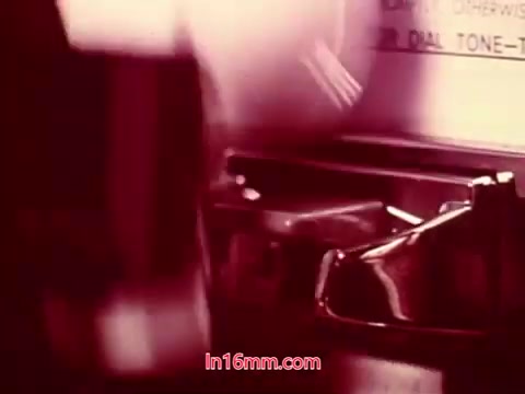 The still from the 16mm film 'Performance' features a close-up of a typewriter, likely captured in a stylized manner typical of the era. The image has a warm, reddish tone, suggesting a vintage aesthetic. The typewriter appears to be mid-use, hinting at themes of communication or creation. The end titles indicate the date of production along with credits for the cast and crew, marking a significant conclusion to the film.