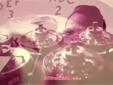 The still from the 16mm film 'Performance' (1971) features an abstract composition, blending visuals of film reels and a figure's silhouette. The background includes numerals, possibly indicating film orientation or editing cues. It conveys a sense of the cinematic process, emphasizing both the mechanical and artistic aspects of filmmaking. This end title frame likely provides production details, including the cast and crew, contributing to the film’s historical context.