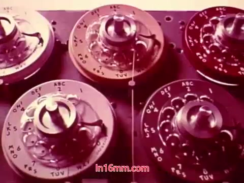The still from the film 'Performance' (1971) showcases close-up shots of control reels or dials, likely part of a sound or recording system. The equipment features various labels and markings, indicative of a cinematic or audio production environment. This scene generally emphasizes the technical aspects of filmmaking. The end titles are likely displayed, providing the production date and listing the cast and crew involved in the project.