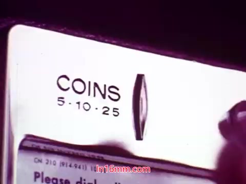 The still from 'Performance' features a close-up of a vintage coin-operated machine, displaying the coin slots for 5, 10, and 25 cents. The background is slightly blurred, emphasizing the machine's details. This moment likely symbolizes a nostalgic or historical reference, characteristic of the film's setting. The end titles provide production details and credit the cast and crew, marking the conclusion of the film.