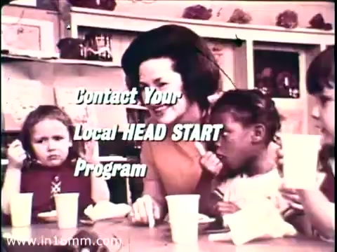 The still features a moment from the 1968 PSA titled 'Head Start,' featuring Lady Bird Johnson. She interacts warmly with children in a classroom setting, highlighting the importance of early childhood education. Text overlay encourages viewers to 'Contact Your Local HEAD START Program.' The image conveys a supportive atmosphere, emphasizing community involvement in education.   Follow us on Twitter @FromFilm for more!