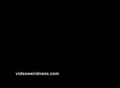 The still appears to be a simple black background featuring the web address 'videoweirdness.com' in white text. This likely serves as a credit or source reference. The context relates to Peace Corps public service announcements from the 1970s, suggesting a connection to themes of service, community, or advocacy from that era.