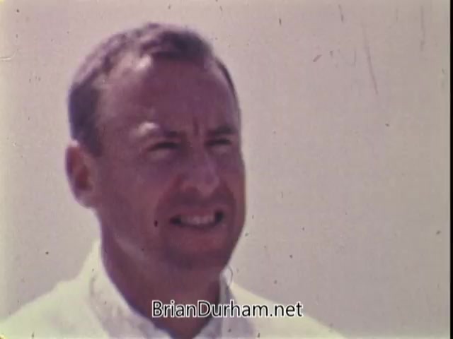 The still captures Captain Jim Lovell speaking directly to the camera. He appears confident and enthusiastic, dressed in a light-colored shirt, set against a plain background. His message emphasizes the limitless potential of youth, highlighting the importance of physical fitness through the presidential physical fitness award for kids aged 10 to 17. The overall tone is motivational and inspiring, reflecting Lovell's achievements as an astronaut.