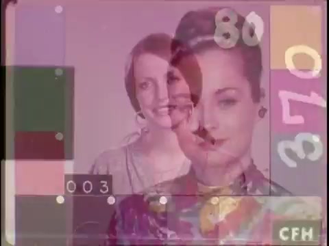 The still features two women, known as 'China girls,' used in 16mm film leaders for color calibration by film labs. The image displays a blend of their portraits with color reference charts and numbers, emphasizing the typical use of these figures in ensuring accurate color reproduction in film processing. The background is likely faded or layered, creating a visual contrast with the featured subjects.